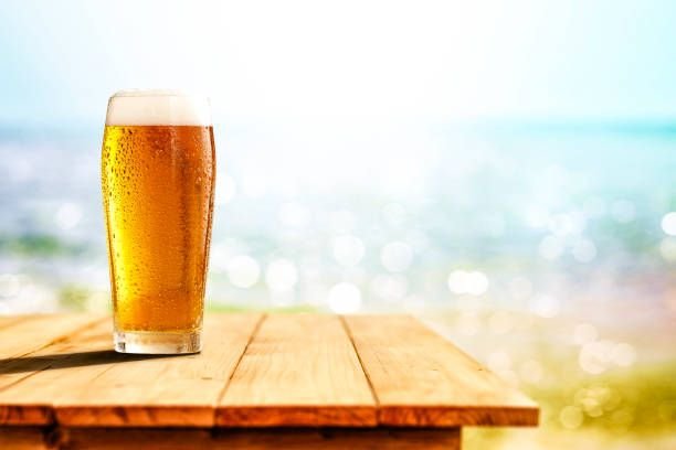 cold-drink-on-wooden-table-with-ocean-and-sandy-beach-background-copy-space-for-advertising8103353244377739300.jpg