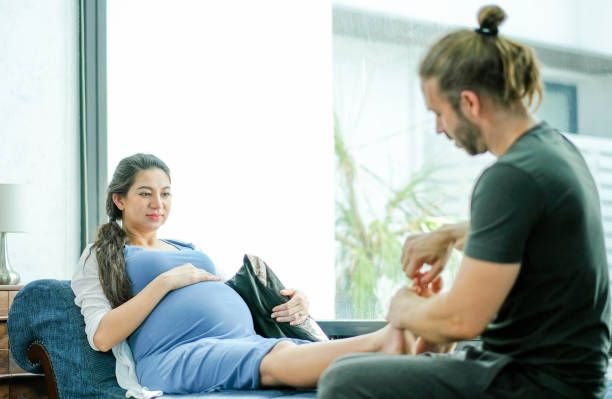 man-massage-to-foot-and-leg-of-his-pregnant-wife-who-sit-on-sofa-in-living-room-concept-of582074668477320487.jpg