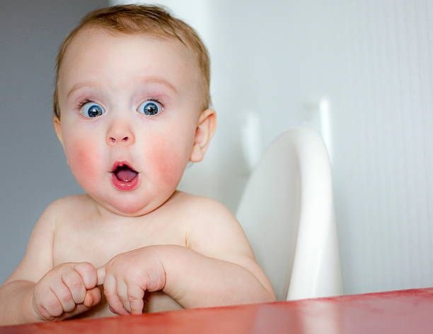 surprised-kid-sitting-at-table5826335590206865616.jpg